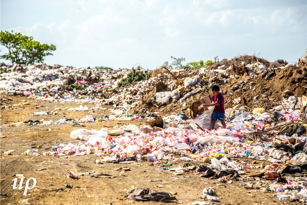 Urban centres generate huge bulks of waste, management of which is a global concern. The lives of those tackling with this menace are often overlooked in front of magnitude of the dumps. Seen here is a boy managing trash in an urban region of central African country of Nicaragua.