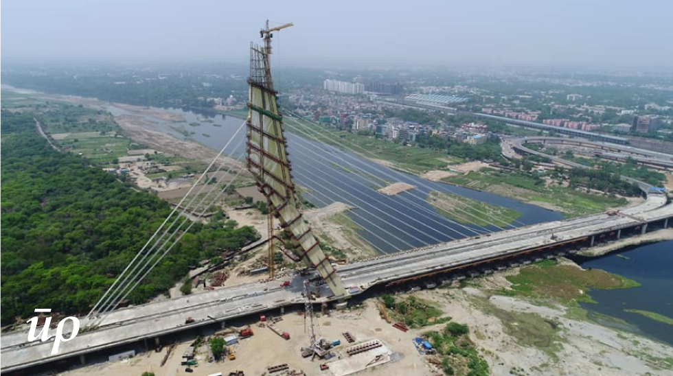 Seen here is a view of under-construction Signature Bridge. It lies downstream of Wazirabad barrage and is the latest bridge, over river Yamuna in Delhi, to be opened for public use.
